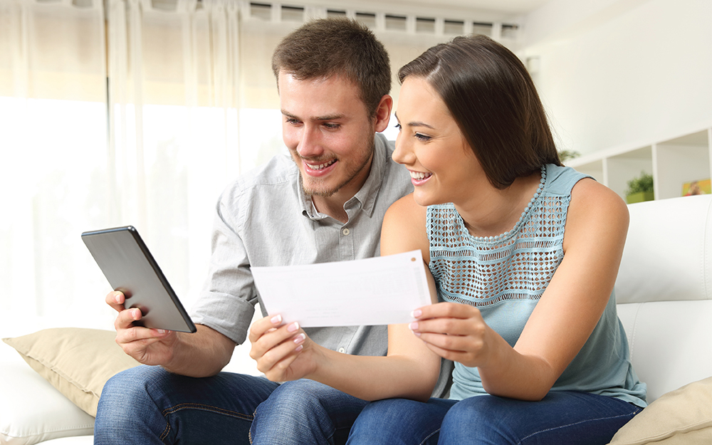 Couple reviewing finances before a home purchase