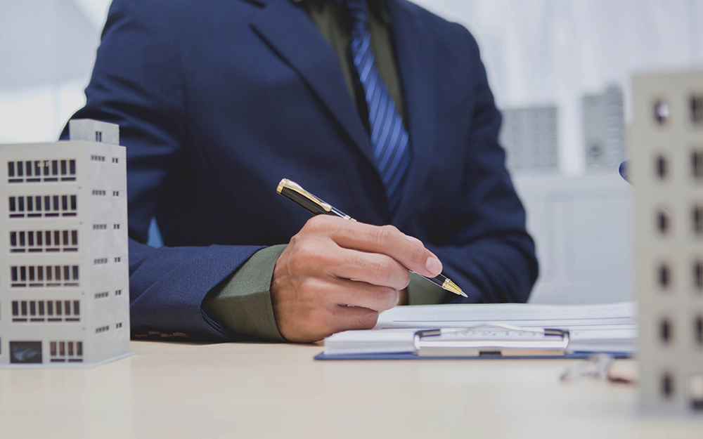 Seller signing a real estate contract
